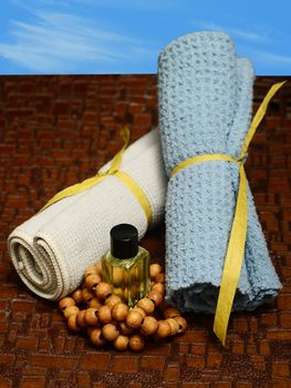 aromatherapy outdoors at spa with wash cloths and essential oil