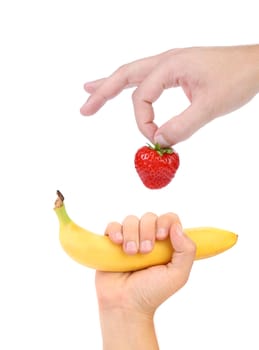 Hands hold Strawberry and Banana. White background.