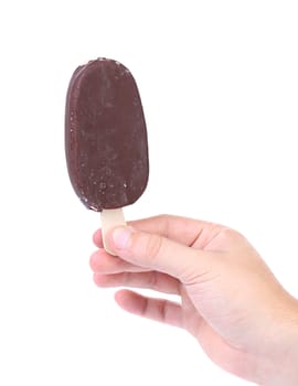 Hand holds chocolate vanilla ice cream isolated on white