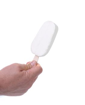 Hand holds vanilla ice cream. White background.