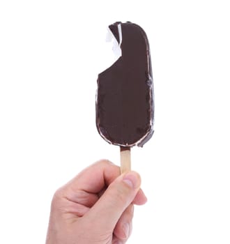 Bitten chocolate vanilla ice cream on stick. White background.