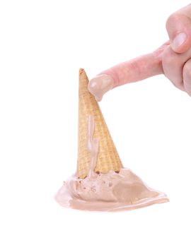 Chocolate ice cream cone fallen and finger. White background.