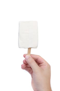 Hand holds white chocolate ice cream. White background.