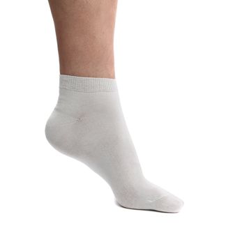 Sock on the foot. Close up. White background.