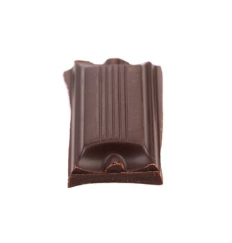 Tasty morsel of dark chocolate. White background.