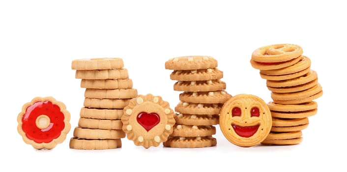 Three stacks of different biscuits. White background.