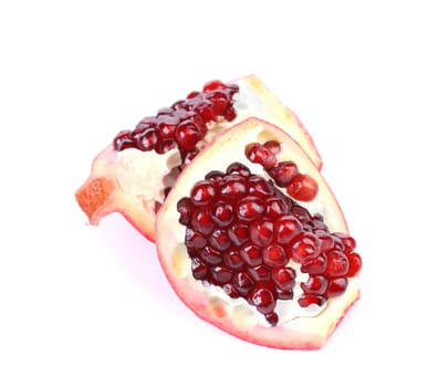 Pomegranate slices isolated on a white backgrount. Close up.