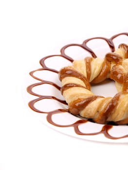 Freshly fancy pretzel baked. Close up. White background.