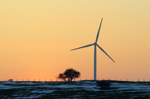 wind turbine on sunset background