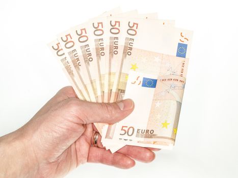 Male person handing over 50 euro bills towards white