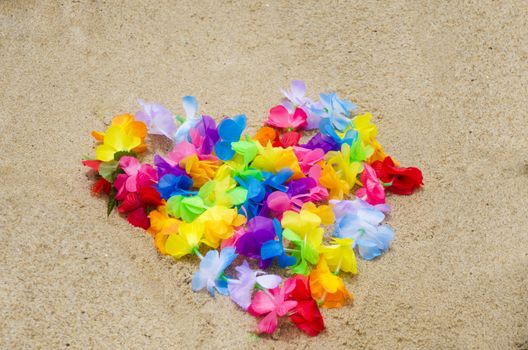 Heart shape of the Hawaiian flowers on the beach