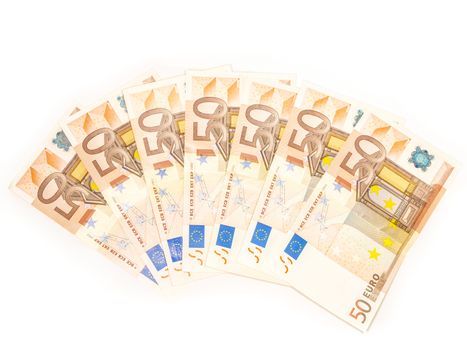 Seven 50 Euro bills in a spread over white background