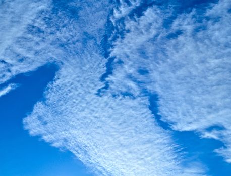 romantic background or texture of white clouds on blue