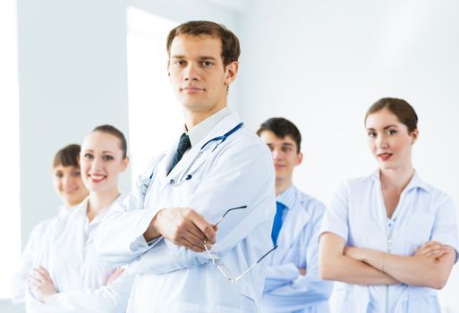 team of experienced highly qualified doctors, fold one's arms