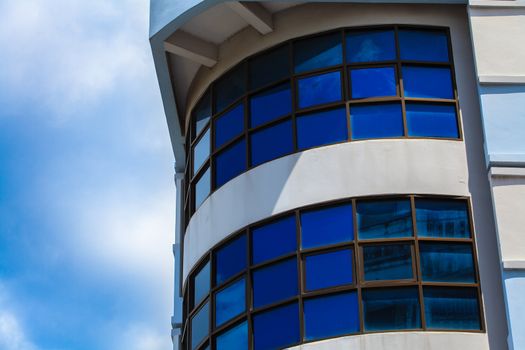 blue sky reflected in modern building mirror glass wall