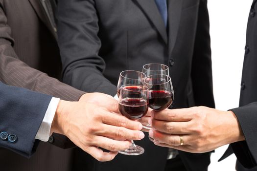 Close-up of human hands cheering up with flutes of wine