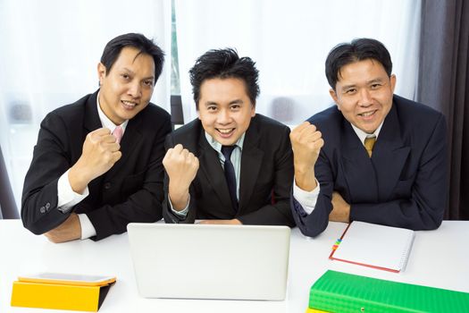 Businessmen celebrate their business success