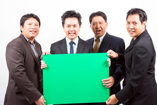 Team of Businessmen holding a blank green banner