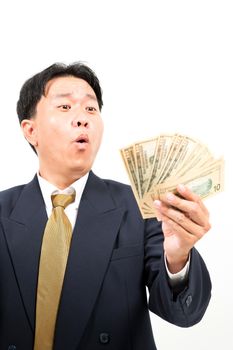 Businessman holding money isolated over white background