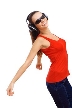 Happy smiling girl dancing and listening to music