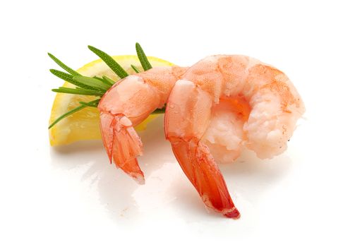 Two tail of shrimp with fresh lemon and rosemary on the white