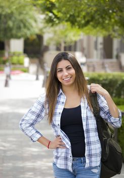 Attractive Young Mixed Race Female Student Portrait on School Campus with Backpack.