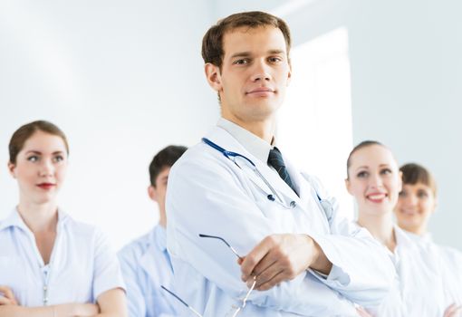 team of experienced highly qualified doctors, fold one's arms