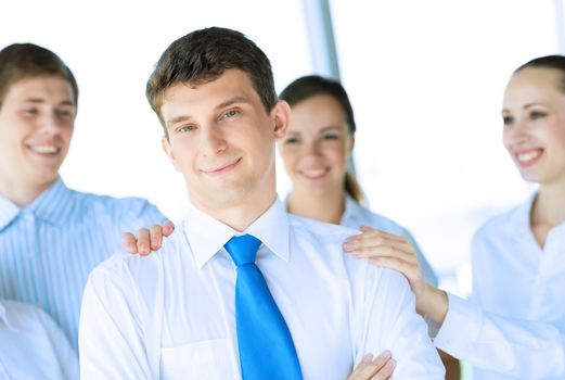 businessman receiving congratulations from his colleagues, business achievements