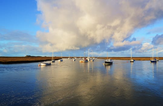 An image of boats moored on the Norfolk coast. Picture taken in early Spring.