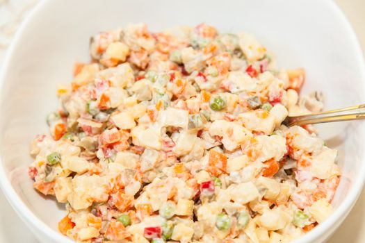 Russian salad or Salade russe, also known as Salade Olivier is a salad composed of diced potato, vegetables and sometimes meats bound in mayonnaise.