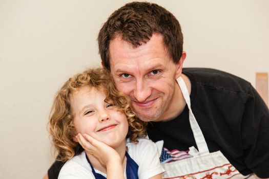 Making gingerbread house together at home before Christmas.