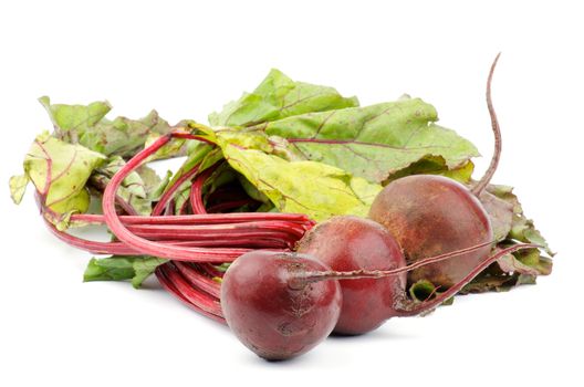 Heap of Fresh Raw Beetroots with Leafy Tops isolated on white background