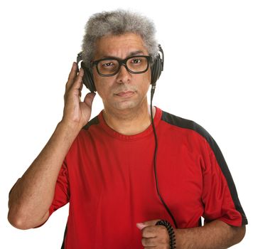 Suspicious Hispanic male holding earphones on head