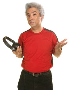 Serious man holding headphones over white background