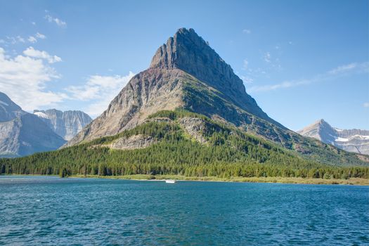 Grinnell Point is directly across the Swiftcurrent Lake from Many Glacier Hotel in Glacier National Park. The elevation at Grinnell Peak is 8,855 feet.