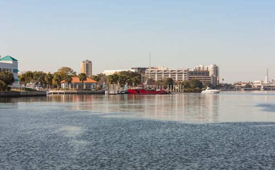 Not only homes but businesses and services line the Hillsborough River at Tampa, Florida. The red boat in the middle of this image is the fire department.