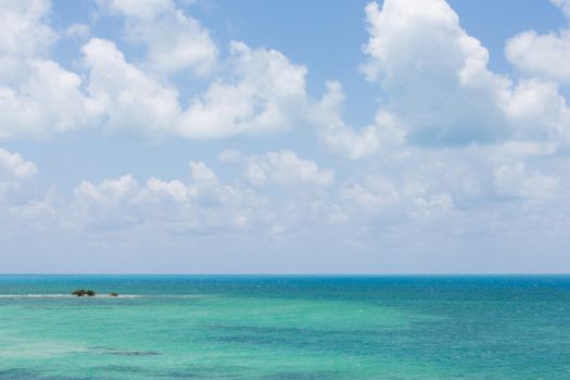 Looking out on the Atlantic from Bahia Honda Key at beautiful water, a very small key, and a cloudscape.