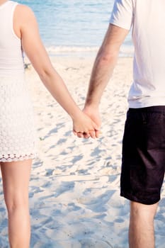 young happy couple in summer holiday vacation summertime beach