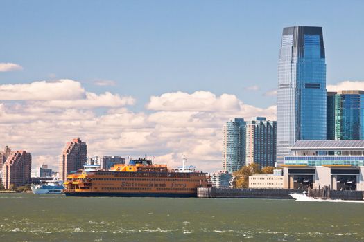 NEW YORK - SEPTEMBER 23: The massive Staten Island Ferry departs from Battery Park in New York City on September 23, 2012. It is a free rides that offers great views of the skyline, and also carries cars.