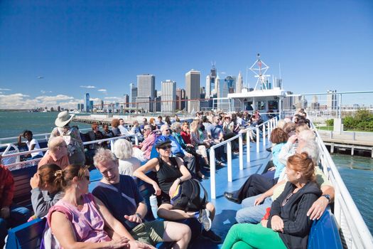 NEW YORK - SEPTEMBER 23: The open deck Governors Island Ferry departs from Brooklyn Park in New York City on September 23, 2012. It is a free weekend rides that offers great views of the skyline of New York.