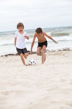 happy family father two kids playing football on beach summer fun soccer