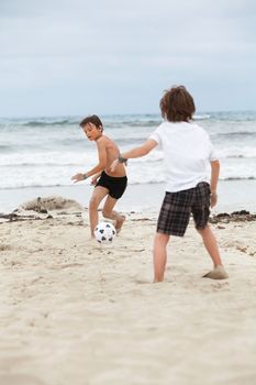 happy family father two kids playing football on beach summer fun soccer