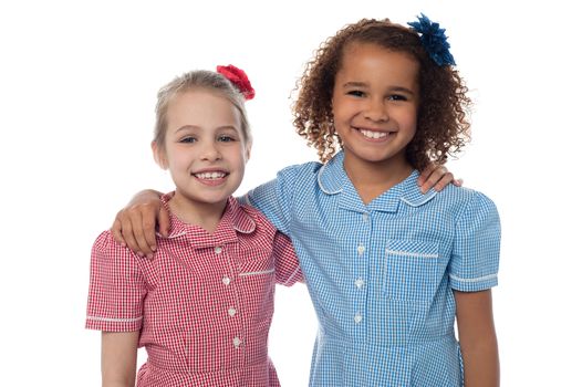 Little school girls posing together