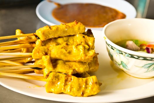 Pork satay, Pork marinated spices. Then light grill. Served with dipping sauce