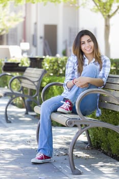 Happy Mixed Race Female Student Portrait on School Campus Bench.