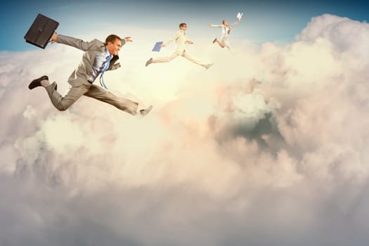 Image of businesspeople jumping high in sky