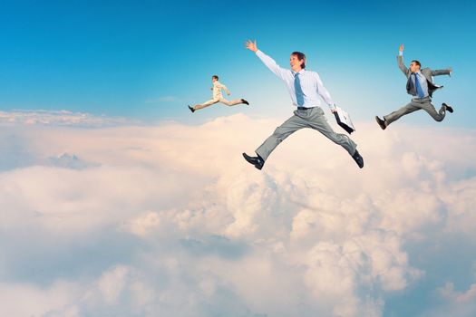 Image of businesspeople jumping high in sky