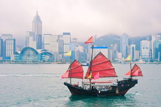 Traditional chinese-style sailboat sailing in Hong Kong harbor
