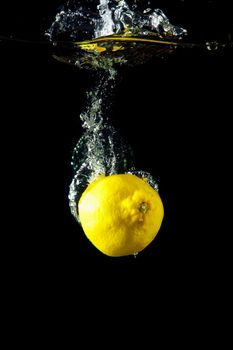 Bright and juicy lemon under water. Fresh and healthy meal