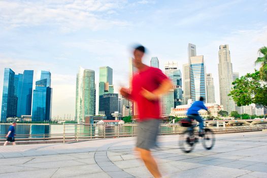 People runing and cycling in the morning in Singapore
